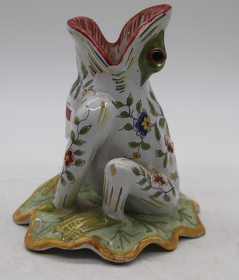 Lot 32 - A French faience spoon warmer, in the form of...