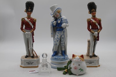 Lot 61 - A pair of porcelain figures of soldiers,...