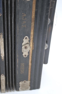 Lot 117 - A vintage Ajax Reeds Champion Band squeezebox,...