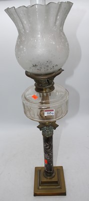 Lot 165 - A Victorian brass oil lamp, the acid etched...