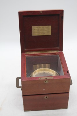 Lot 167 - A brass Dunhill quartz clock, housed in a...