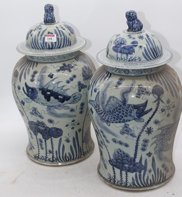 Lot 144 - A pair of Chinese blue & white glazed temple...