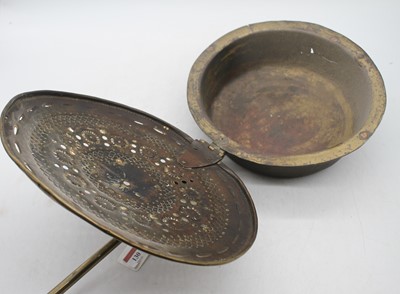 Lot 130 - An 18th century pierced brass warming pan, 105cm