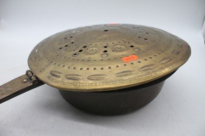 Lot 130 - An 18th century pierced brass warming pan, 105cm