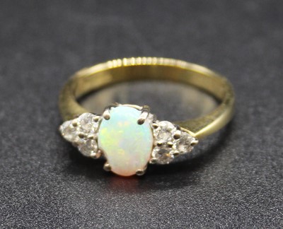 Lot 388 - An 18ct gold, opal and diamond dress ring,...