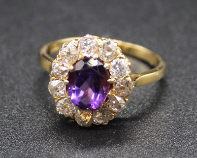 Lot 389 - An 18ct gold, amethyst and diamond cluster...