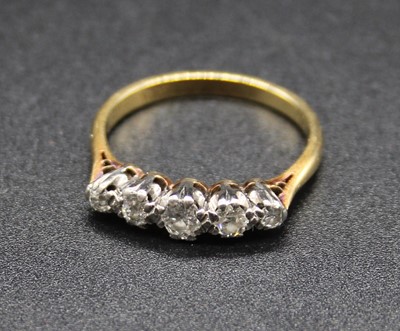 Lot 390 - An 18ct gold diamond five stone ring, arranged...