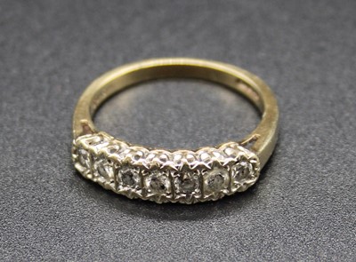 Lot 392 - A 9ct gold diamond half hoop ring, arranged as...