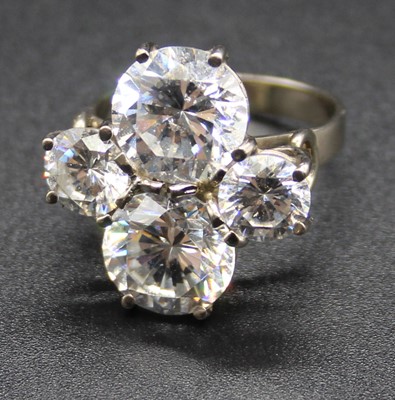 Lot 398 - A white metal and cz set dress ring, arranged...