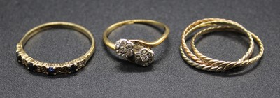 Lot 407 - An 18ct gold diamond crossover ring, size K;...