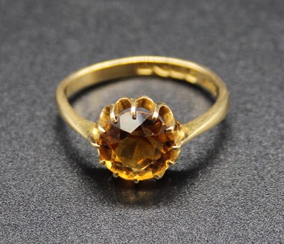 Lot 408 - An 18ct gold and citrine solitaire ring, the...