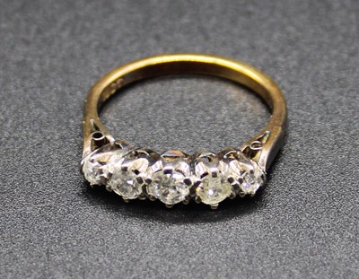 Lot 411 - An 18ct gold diamond five stone ring, the five...