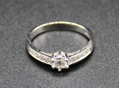 Lot 412 - A modern 18ct white gold diamond dress ring,...