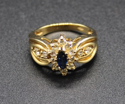 Lot 413 - A modern yellow metal, sapphire and diamond...