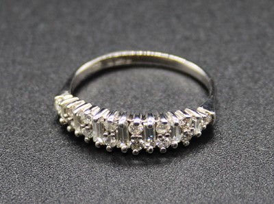 Lot 416 - A modern 18ct white gold diamond half hoop...