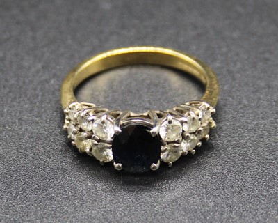 Lot 417 - A modern 18ct gold, sapphire and diamond set...