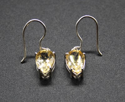 Lot 419 - A pair of contemporary white metal and pear...