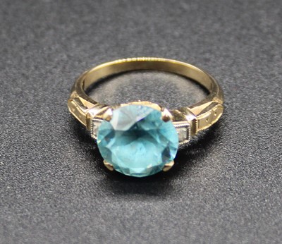 Lot 421 - A yellow metal, blue zircon and white sapphire...