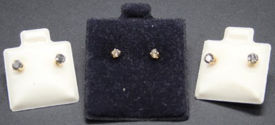 Lot 437 - Three pairs of yellow metal and diamond set...