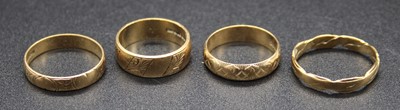 Lot 457 - Four various 9ct gold wedding bands, each with...