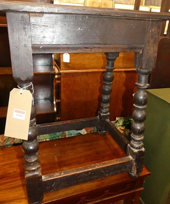 Lot 1300 - An antique joined oak joint stool, having a...