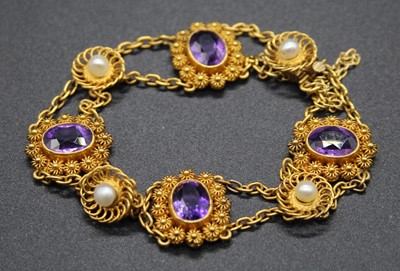 Lot 466 - An early 20th century yellow metal, amethyst...