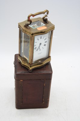 Lot 251 - A brass carriage clock, the enamel dial...