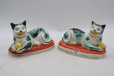 Lot 267 - A pair of Staffordshire pottery models of cats,...