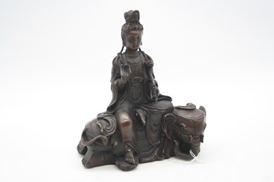 Lot 280 - A reproduction bronzed figure of a deity, in...