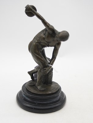 Lot 285 - A bronzed figure of a discus-thrower, signed...
