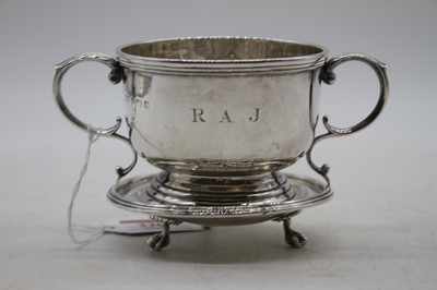 Lot 320 - A George V silver cup having twin leaf capped...