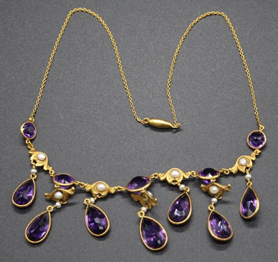 Lot 467 - An early 20th century yellow metal, amethyst...