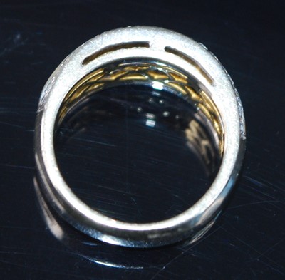 Lot 2677 - A yellow metal fancy yellow diamond three-row...