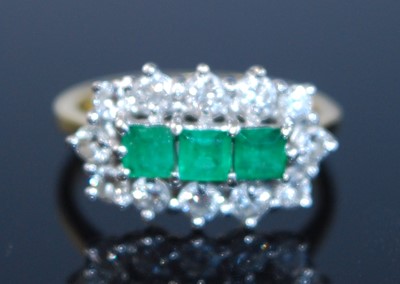 Lot 2356 - An 18ct yellow and white gold, emerald and...