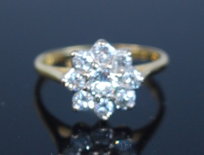 Lot 2340 - An 18ct yellow and white gold diamond flower...
