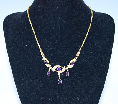 Lot 2320 - A yellow metal, amethyst and seed pearl fringe...