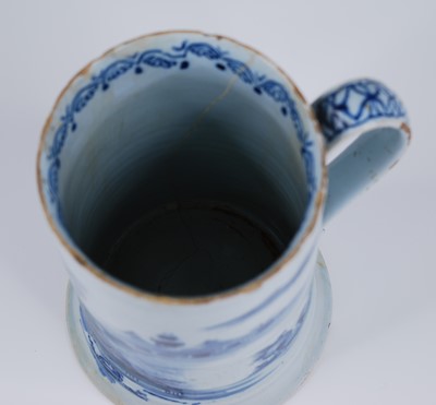 Lot 2079 - An English blue and white delftware tankard,...
