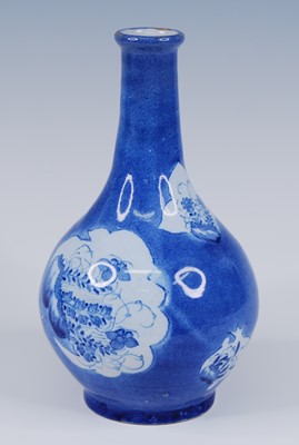 Lot 2073 - An English blue and white delftware bottle...