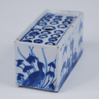 Lot 2088 - An English blue and white delftware flower...