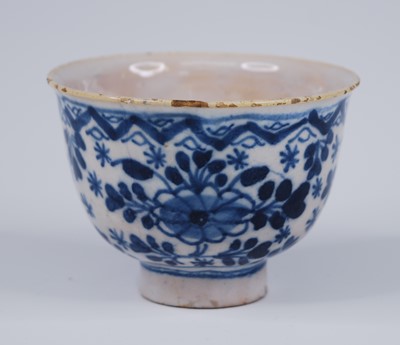Lot 2155 - A Delft blue and white tea bowl, probably 18th...