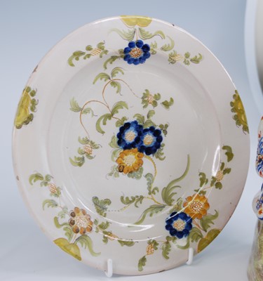 Lot 2130 - A French polychrome faience dish, 18th century,...