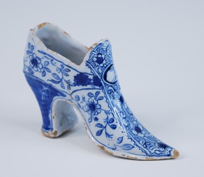 Lot 2078 - An English blue and white delftware shoe,...