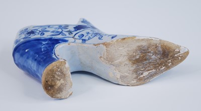 Lot 2078 - An English blue and white delftware shoe,...