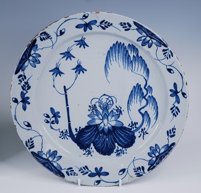 Lot 2102 - An English blue and white delftware charger,...
