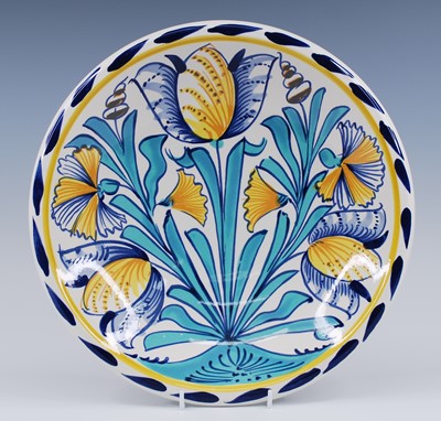 Lot 2204 - A Delft polychrome charger, 20th century, in...