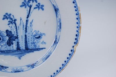 Lot 2074 - An English blue and white delftware charger,...