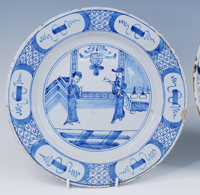 Lot 2100 - An English blue and white delftware charger,...