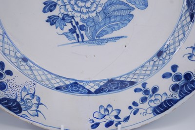 Lot 2106 - An English blue and white delftware charger,...