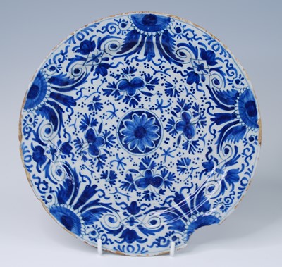 Lot 2145 - A Delft blue and white charger, 18th century,...