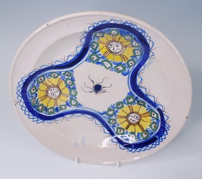 Lot 2142 - A collection of five Delft polychrome chargers,...